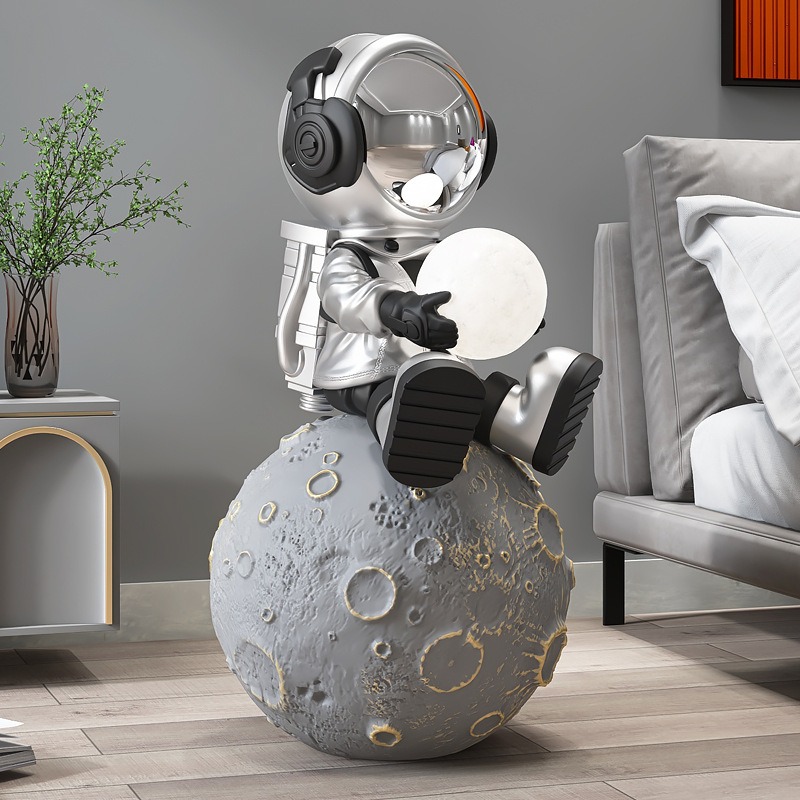 Mẫu tượng phi hành gia nhí ngồi trên mặt trăng để sàn